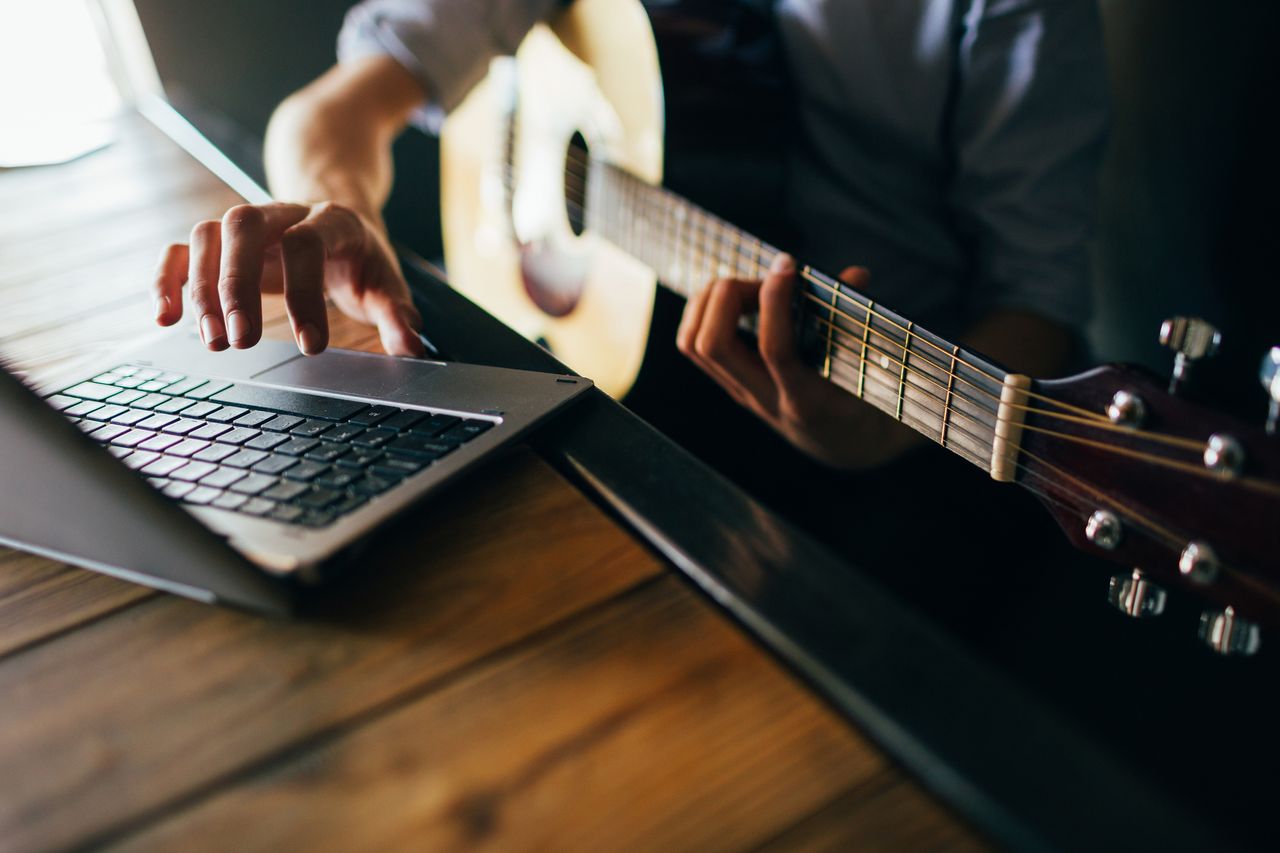 A man playing guitar.