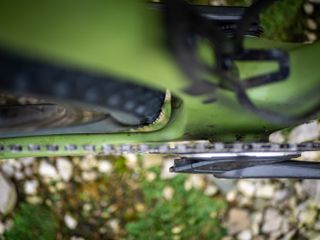 Detail photo of a green Ridley ASTR RS leaning against a wooden fence