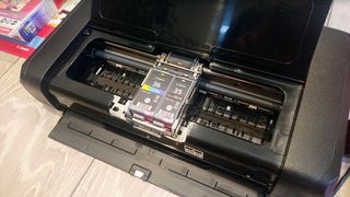 Canon PIXMA TR150 Wireless Inkjet Printer being tested in writer's home