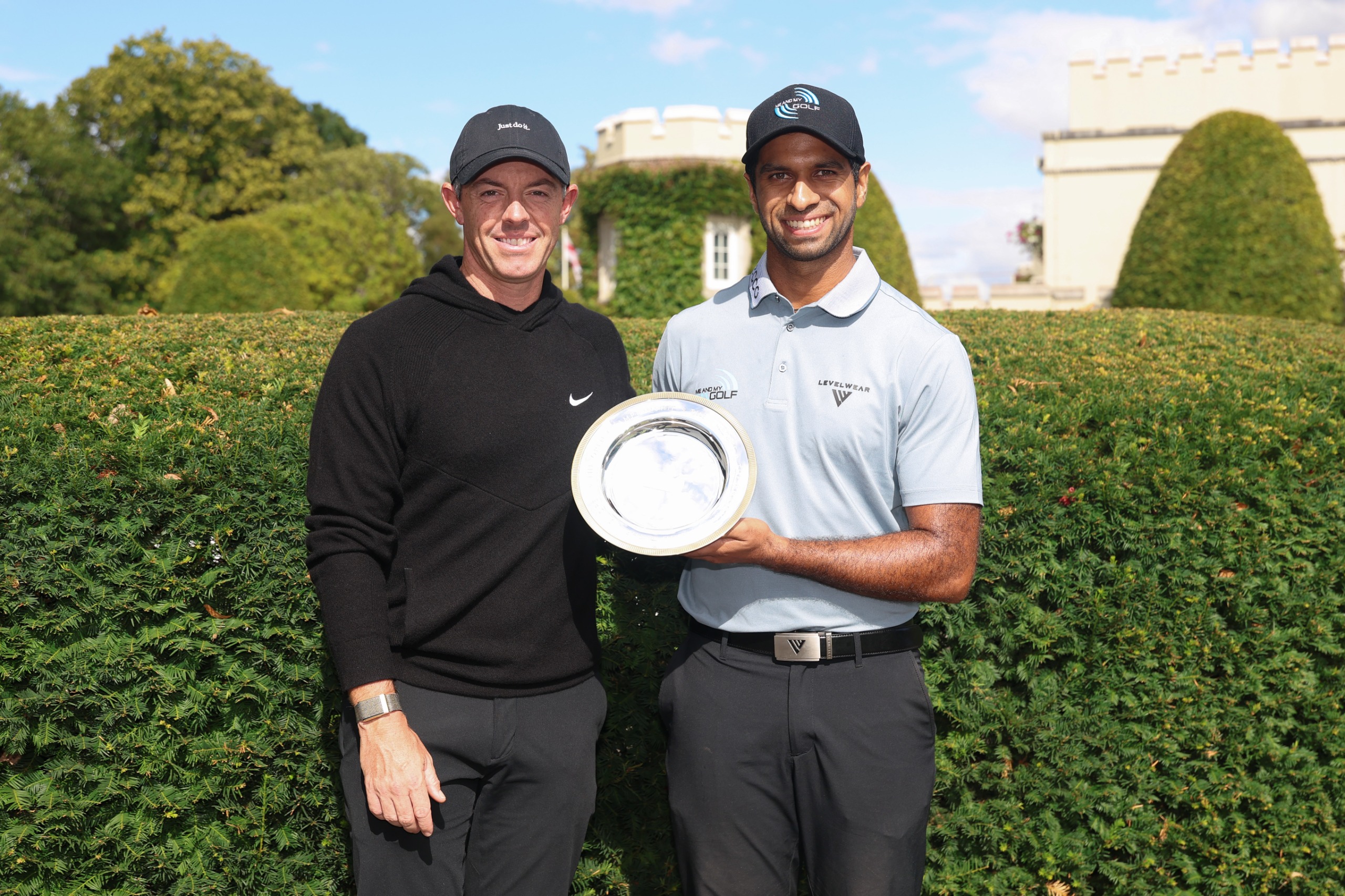 Rory McIlroy and Aaron Rai pose with the Rory McIlroy award ahead of the 2026 BMW PGA Championship