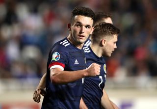 Scotland’s John McGinn celebrates scoring the winner