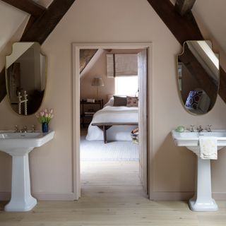 An attic with a bathroom and bedroom
