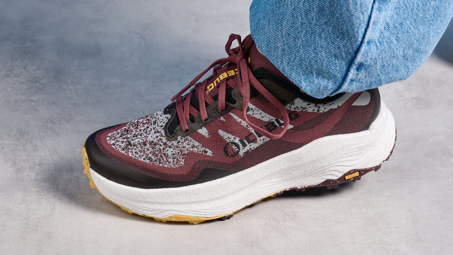 the icebug j&amp;auml;rv rb9x trail running shoes in cherry and banana photographed against the tom's guide blue background