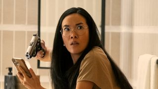 Ali Wong as Amy holds a gun in Beef