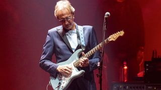 Mike Rutherford of Genesis playing a Squier Bullet Strat on tour last year
