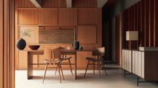 A mid century wooden dining room with wood cabinets and chairs