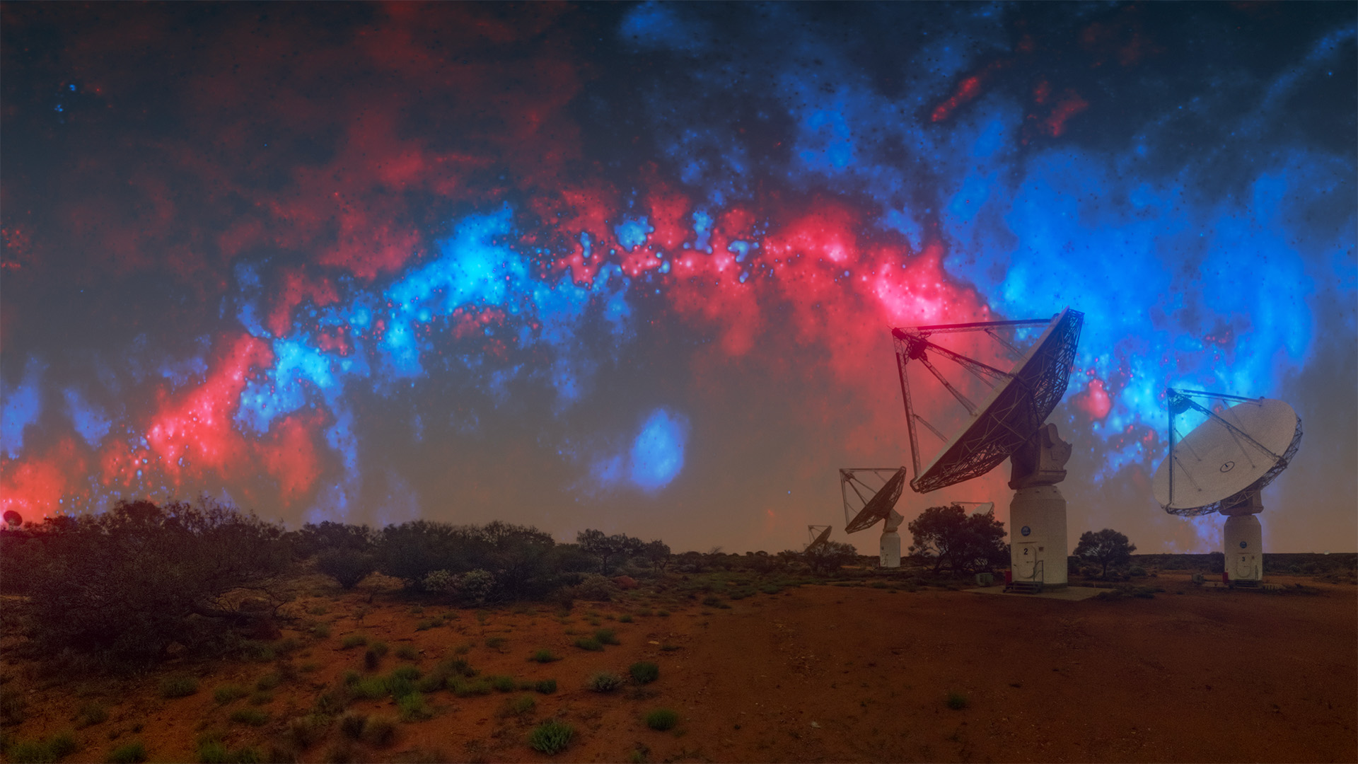 A series of satellite dish telescopes to the right under a blue and red night sky.