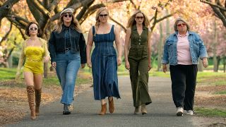 A group of women walking towards the screen as they walk through a park in Kinda Pregnant