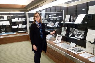 Tracy Grimm, associate head of Purdue University's Archives and Special Collections and Barron Hilton Archivist for flight and space exploration conducts a tour of "Apollo in the Archives: Selections from the Neil A. Armstrong Papers" exhibit.
