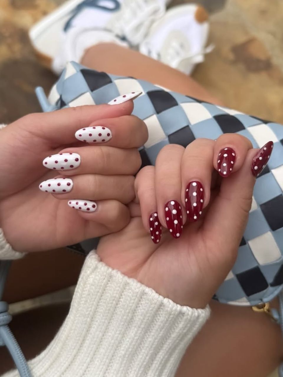 An image featuring a polka dot burgundy design by @nailsbyzola