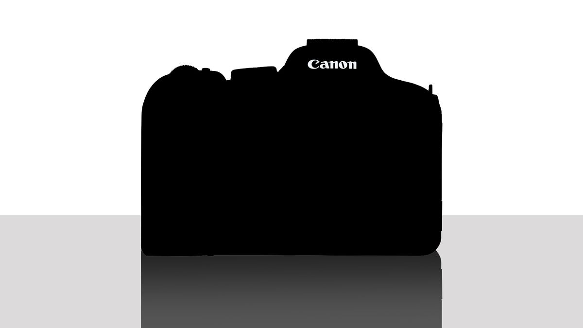 Silhouette of a mystery Canon camera, against a white background on a reflective grey surface