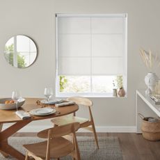 White blind over window in dining room