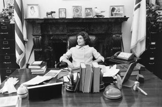 Jackie sits at JFK’s senate desk, Washington DC