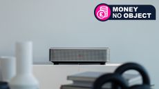 The Leica Cine 1 projector on a table with a money no object tag