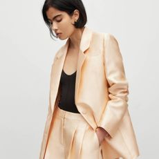 woman wearing a gold blazer