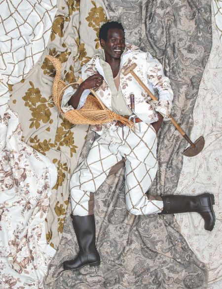 Black male model swathed in fabrics