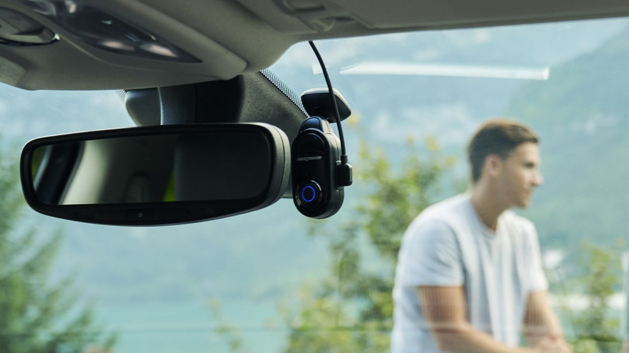 Nextbase Piqo dash cam attached to a car windscreen