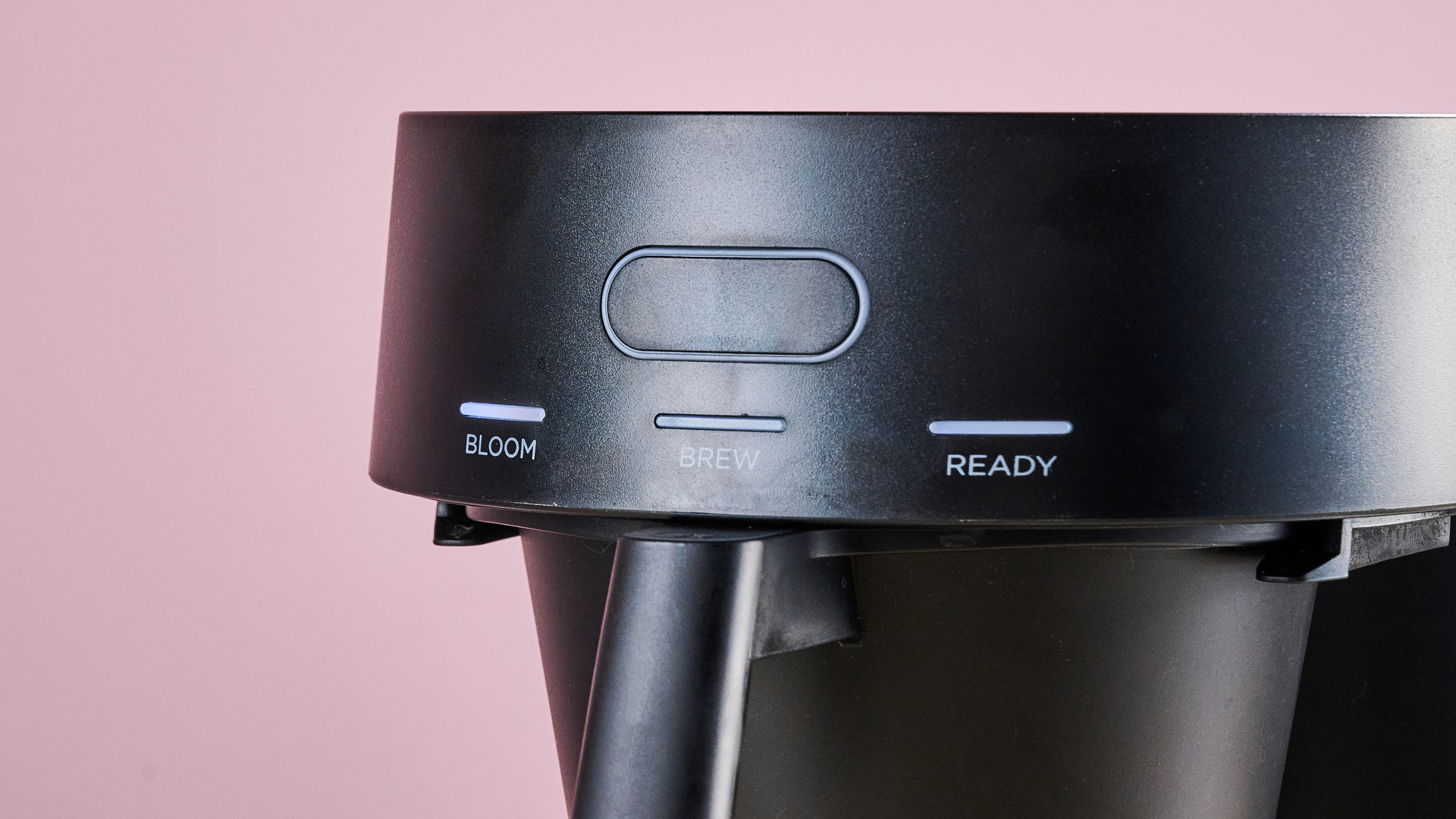 A closeup of the front of the Ratio Four, showing its button and lights that read 'Bloom', 'Brew' and 'Ready'.
