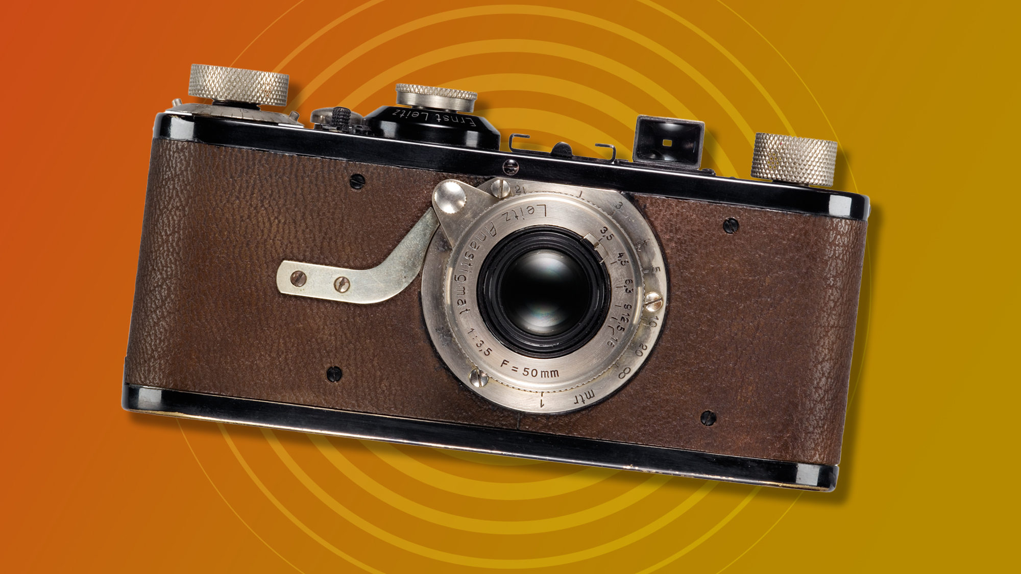 Leica I camera with brown leather finish, orange / yellow background with radar graphic