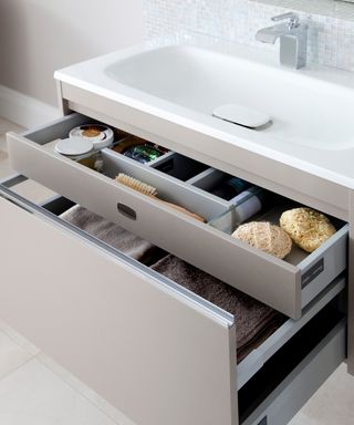 An example of small bathroom storage ideas showing a close-up shot of a single bathroom vanity with storage drawers