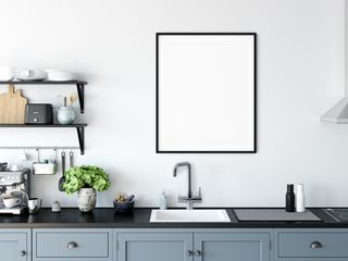 INTU boiling water tap in a monochrome modern kitchen with black countertops