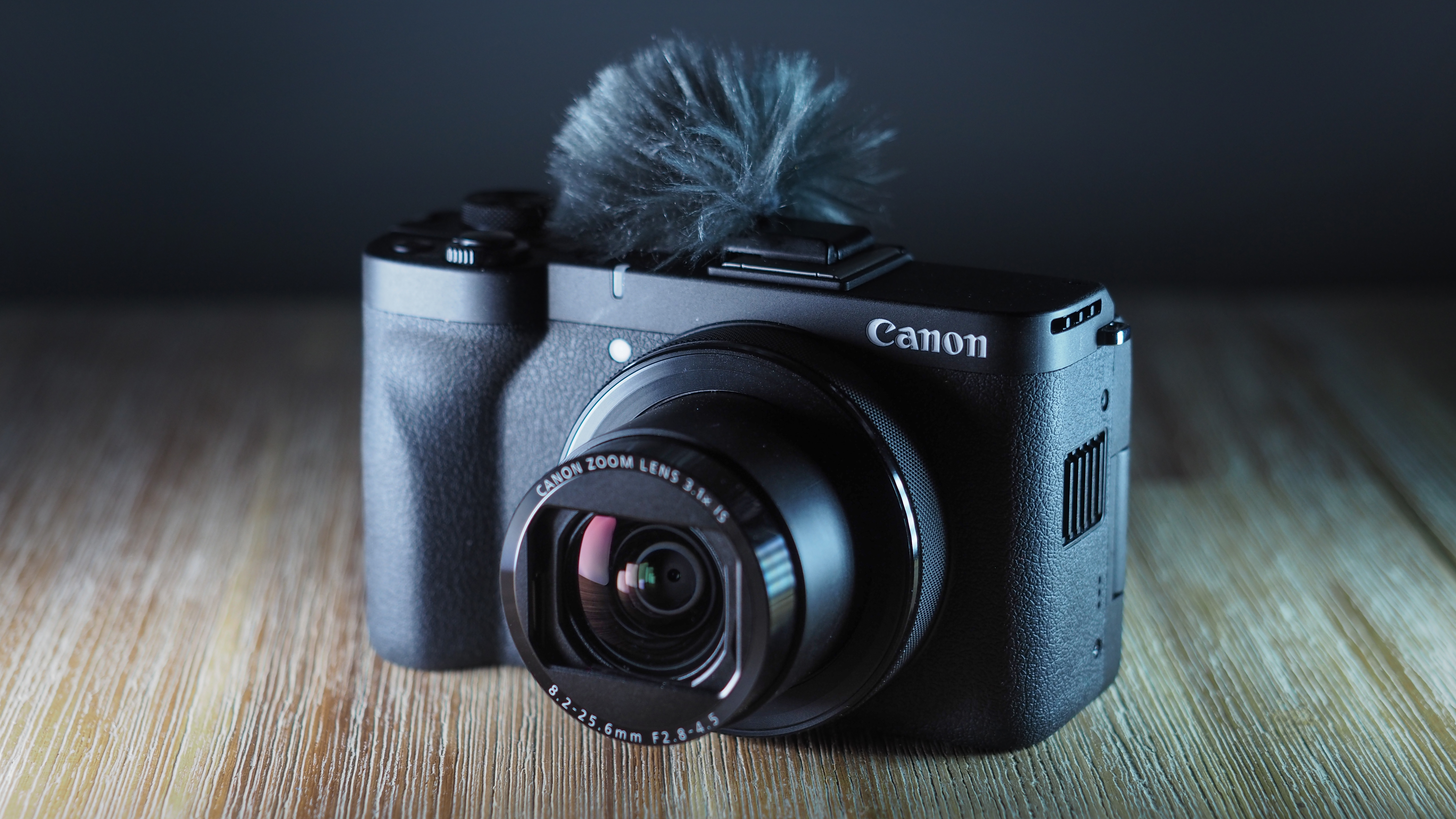 Canon PowerShot V1 on a wooden surface
