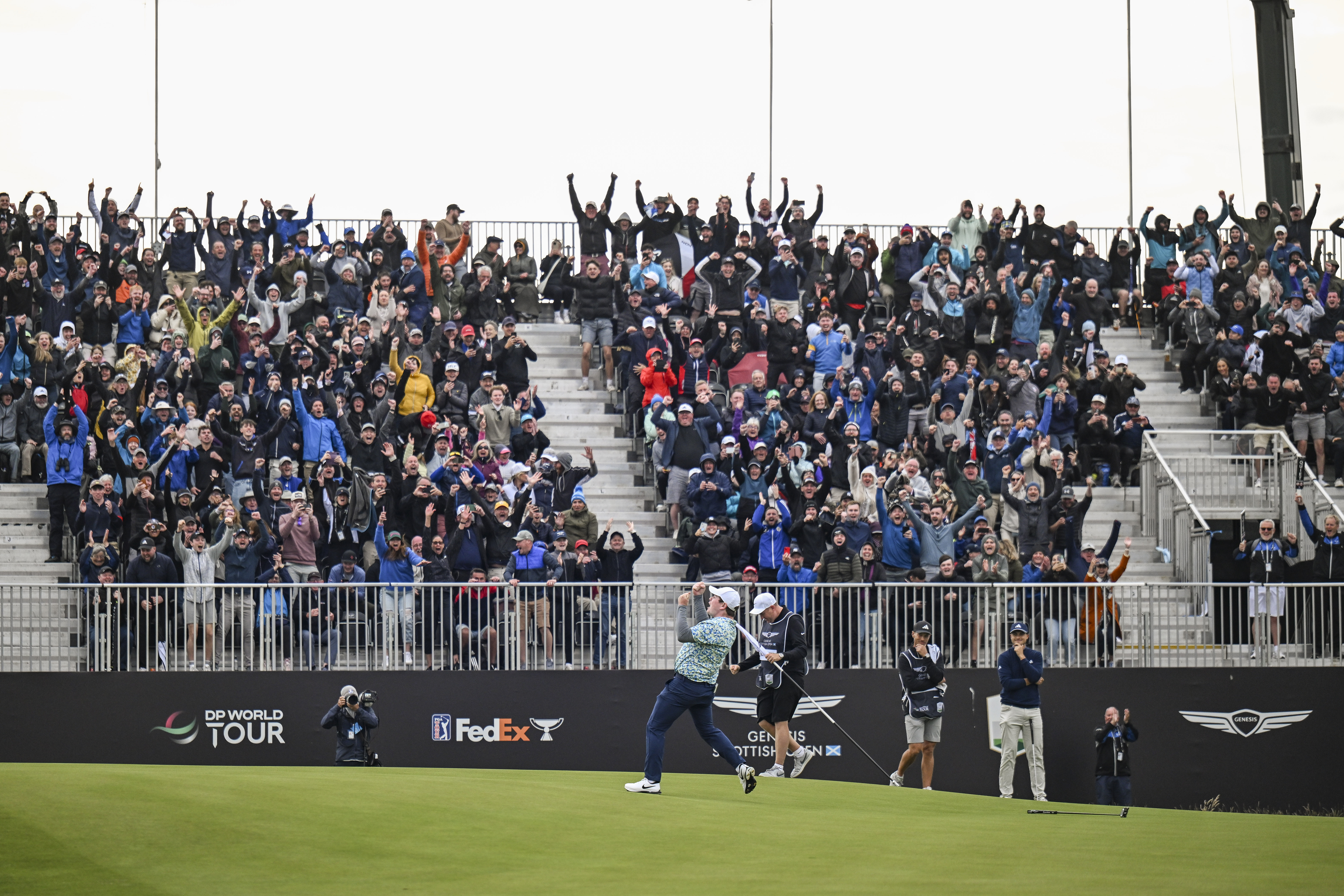 Robert MacIntyre celebrates after claiming the Genesis Scottish Open