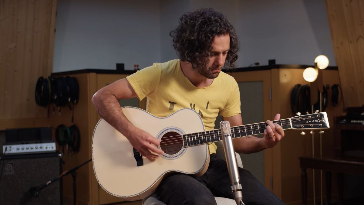 A guitarist plays a Reverb Select Martin Custom GP Blonde