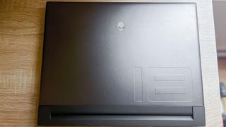 Alienware m18 review unit on desk, lid facing camera