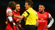 LONDON, ENGLAND - FEBRUARY 19:Bacary Sagna of Arsenal appeals to Referee Nicola Rizzoli during the UEFA Champions League Round of 16 first leg match between Arsenal and FC Bayern Muenchen at 