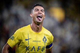 Cristiano Ronaldo celebrates after scoring for Al-Nassr against Al-Wehda in the Saudi Pro League in May 2024.