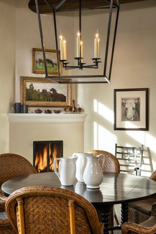 farmhouse circular table in front of fireplace