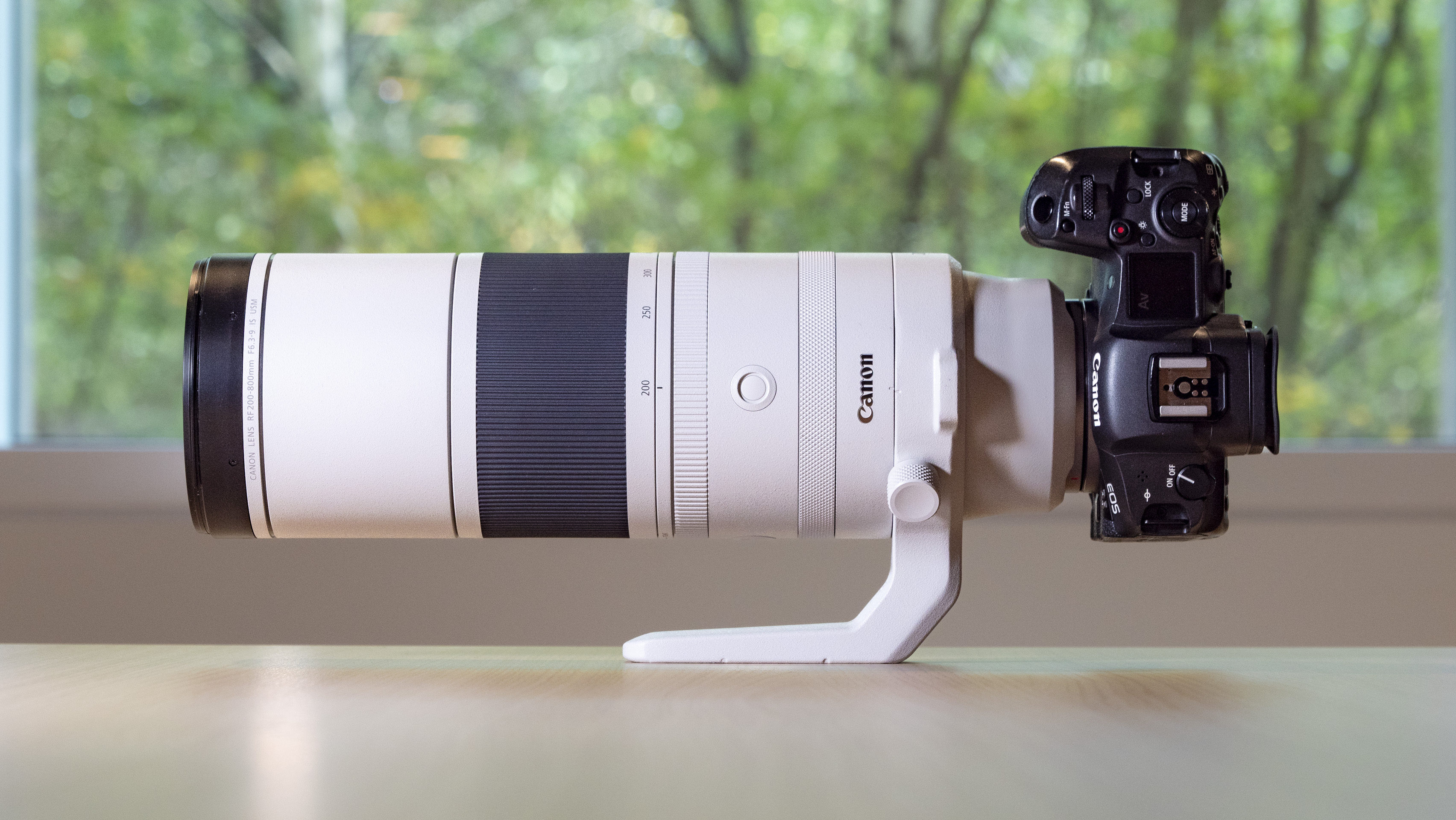 Canon RF 200-800mm F6.3-9 lens on a table at its 200mm setting, mounted to a Canon EOS R5