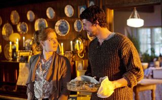 amy adams and matthew good bake together in a cozy kitchen in the movie leap year