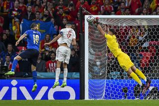 Italy’s goalkeeper Gianluigi Donnarumma saves a shot