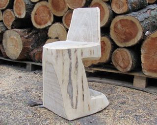 Solid wood chair made out of a tree trunk