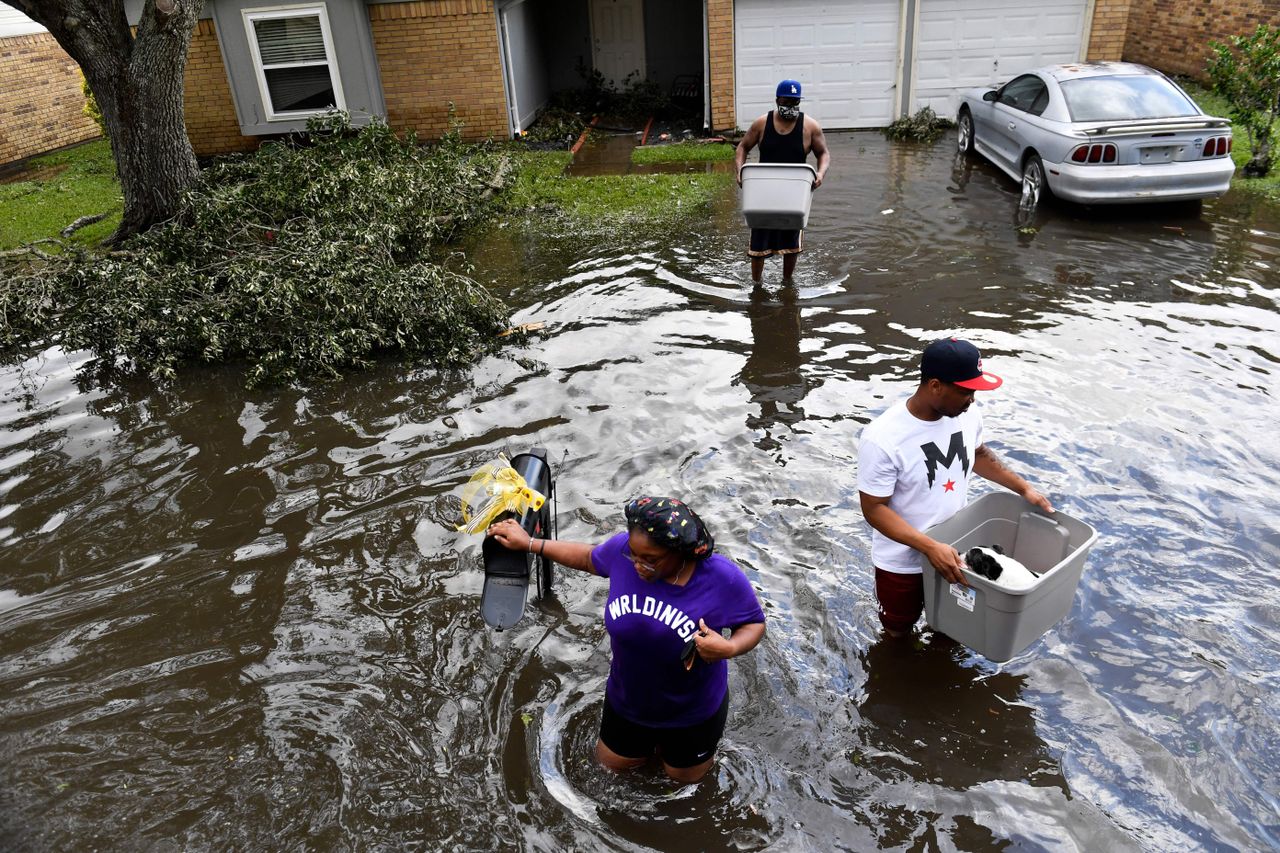 Residents leave flooded homes