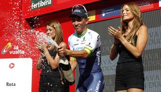 Caleb Ewan pops the champagne after his Vuelta stage win