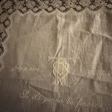 Maren Morris shares a souvenir from Taylor Swift and Travis Kelce's wedding, which is a white embroidered doily napkin featuring lyrics from Blank Space