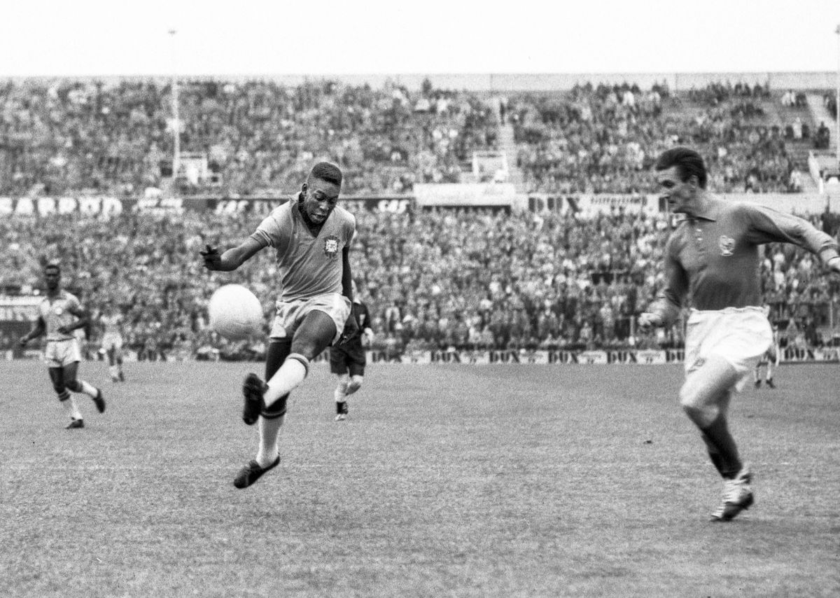 Pele shoots during the 1958 World Cup semi-final between Brazil and France at the Rasunda Stadium in Stockholm, Sweden