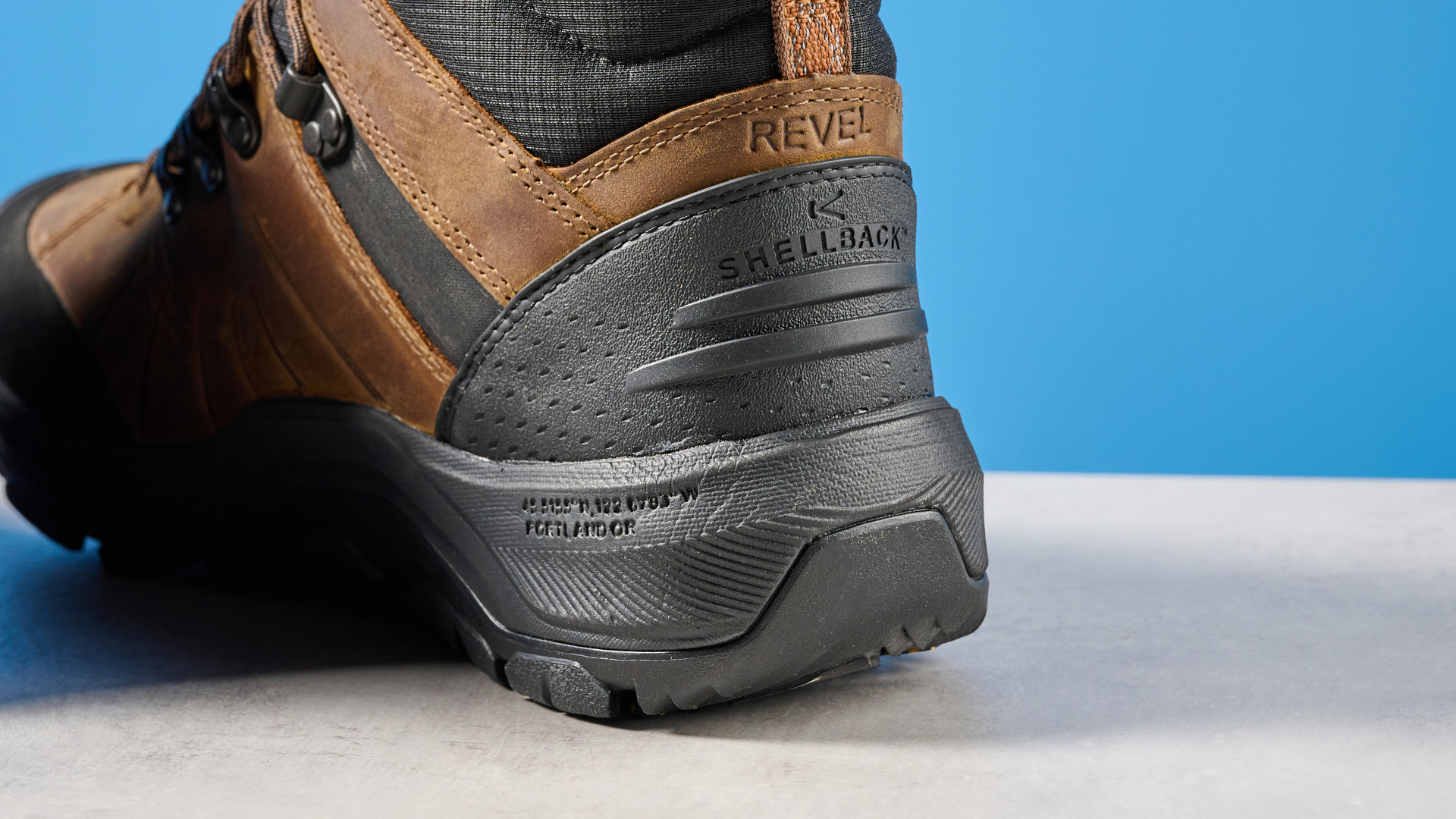 The Keen Revel IV heel protection on a stone surface