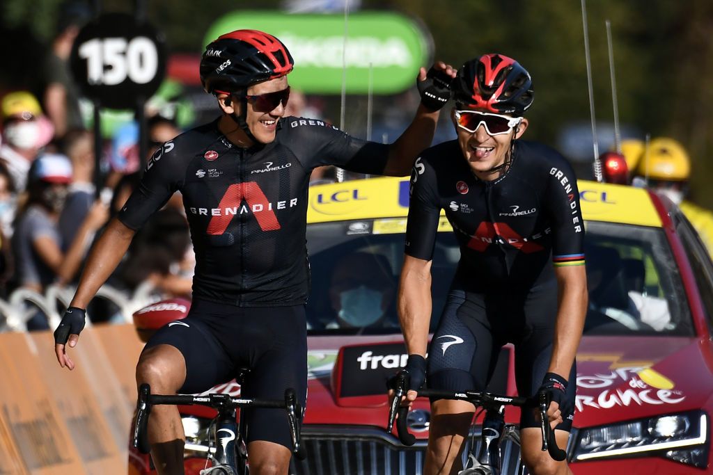 TOPSHOT Team Ineos rider Polands Michal Kwiatkowski R celebrates before crossing the finish line ahead of Team Ineos rider Ecuadors Richard Carapaz L during the 18th stage of the 107th edition of the Tour de France cycling race 168 km between Meribel and La Roche sur Foron on September 17 2020 Photo by Marco Bertorello AFP Photo by MARCO BERTORELLOAFP via Getty Images