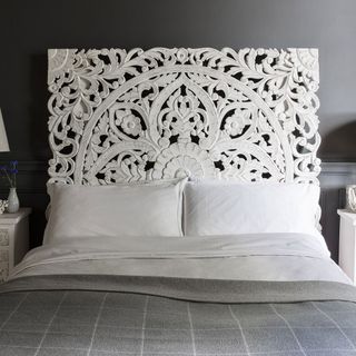 White Atkin & Thyme headboard on a bed with gray sheets and white pillows
