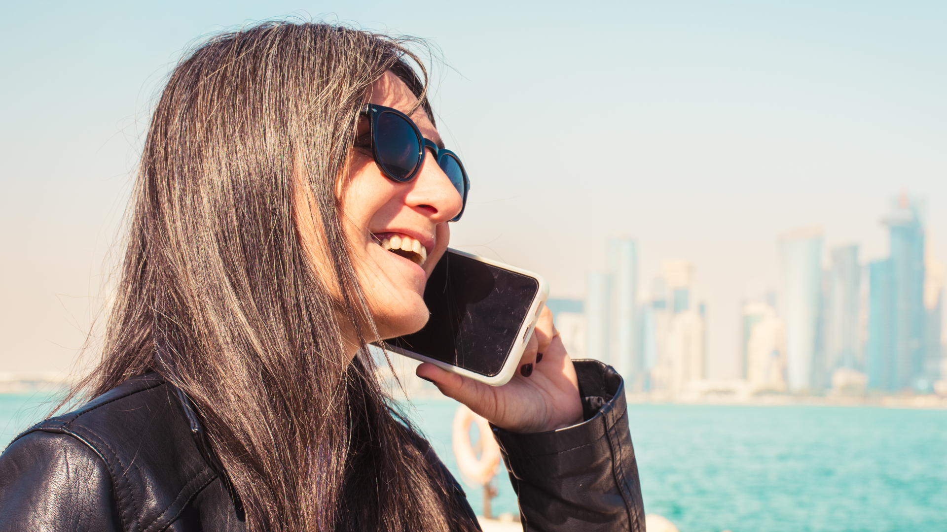 A lady on the phone while on a city break holiday