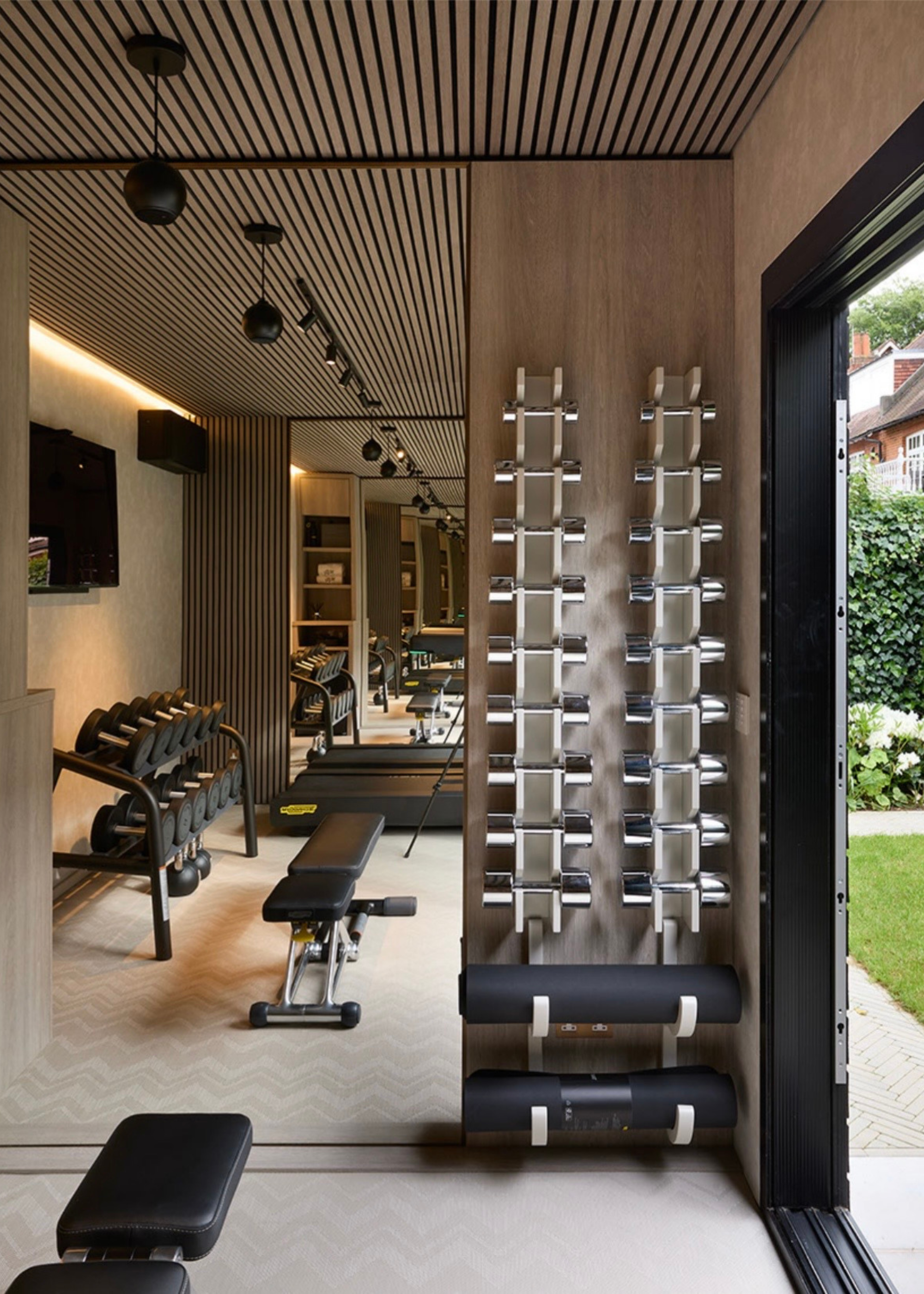 beautiful gym in a garden shed with modern sleek equipment