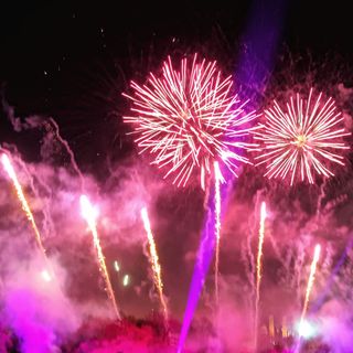 pink fireworks display against dark sky