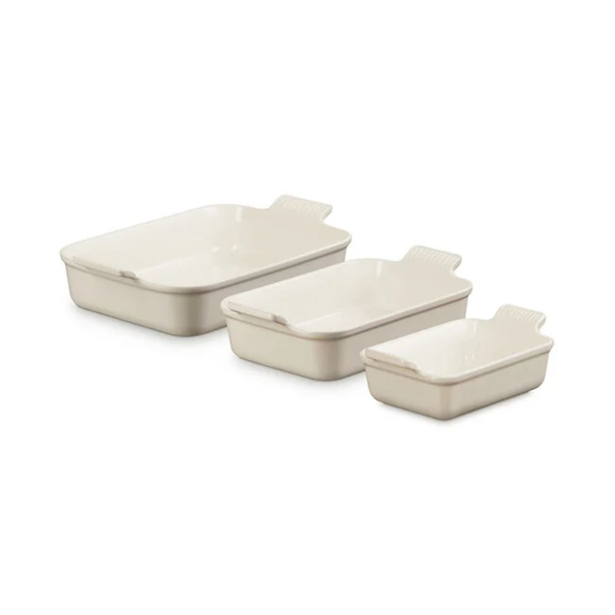 A cream cast iron three piece baking dish set