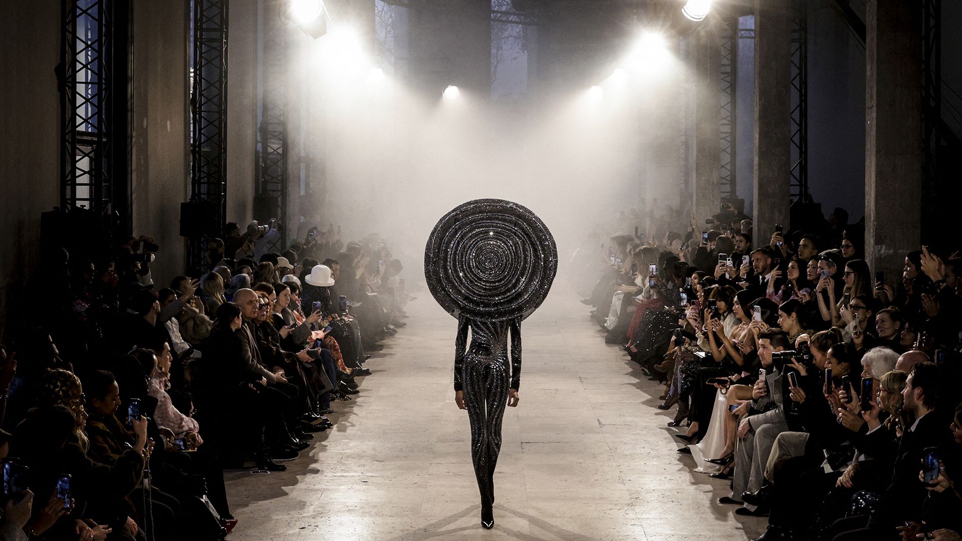 
                                A model presents a creation by Rahul Mishra as part of the Haute Couture Spring/Summer 2026 show during Paris Fashion Week in France
                            