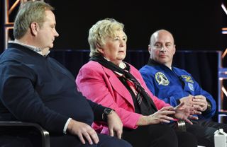 Frances "Poppy" Northcutt (center), flanked by director Tom Jennings (left) and retired astronaut Garrett Reisman (right), during the "Apollo: Missions to the Moon" panel at the February 2019 Television Critics Association Winter Press Tour in Pasadena, California.