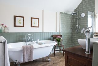 Sag green bathroom with a roll top bath